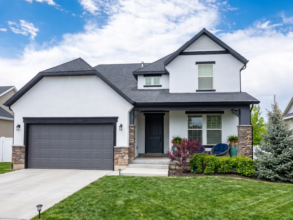 Utah home exterior repaint in white and charcoal